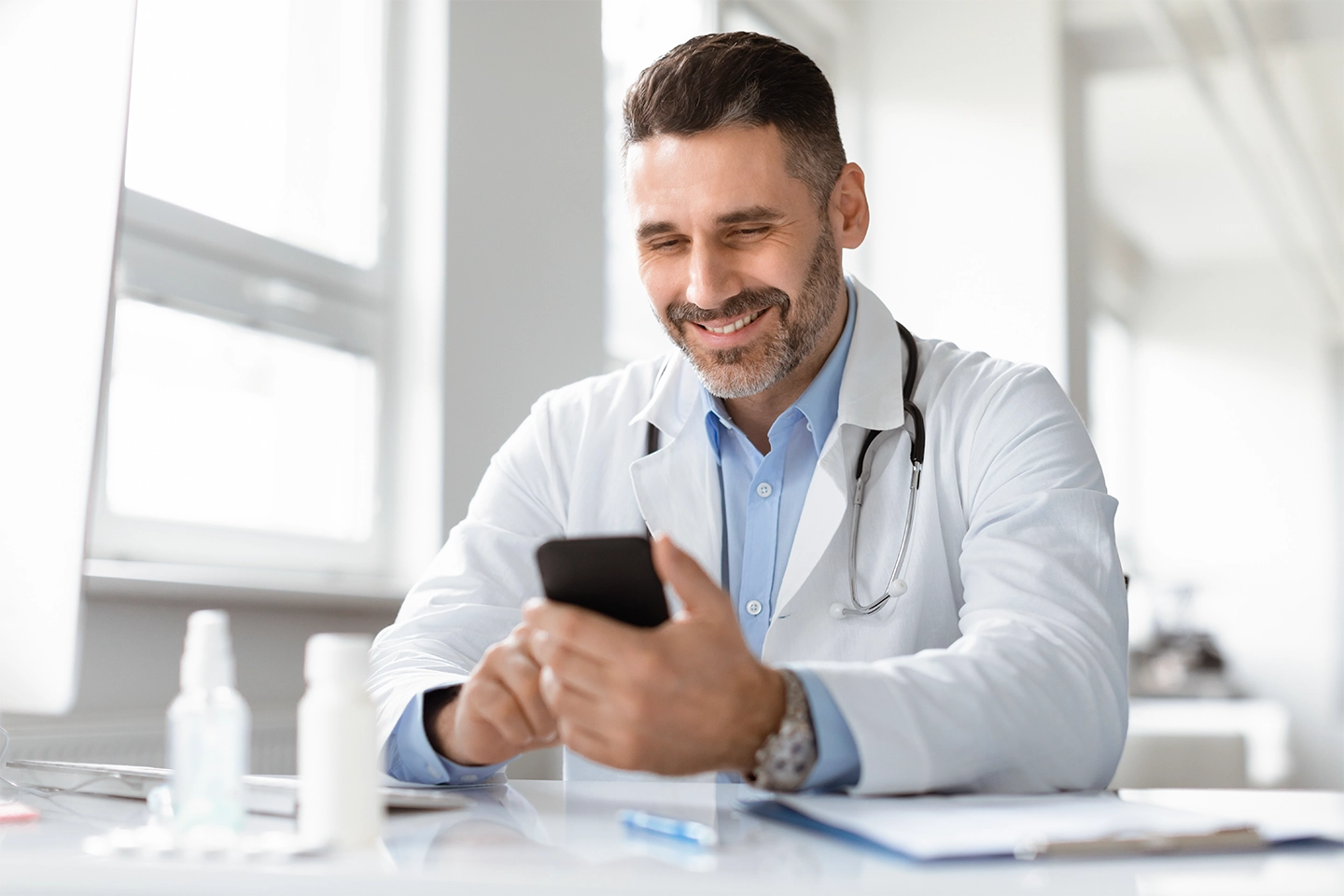 Physician using a mobile device for the Providence Anesthesiology Associates case study